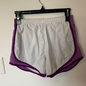 White and purple Nike running shorts